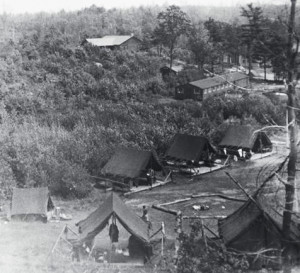 Skunk Hollow at Camp Norshoco with platform tents and the  old dining hall and post-office ( barely visible at the right..) The new dining hall is near the top. Photo by Dave Crowley, age 14